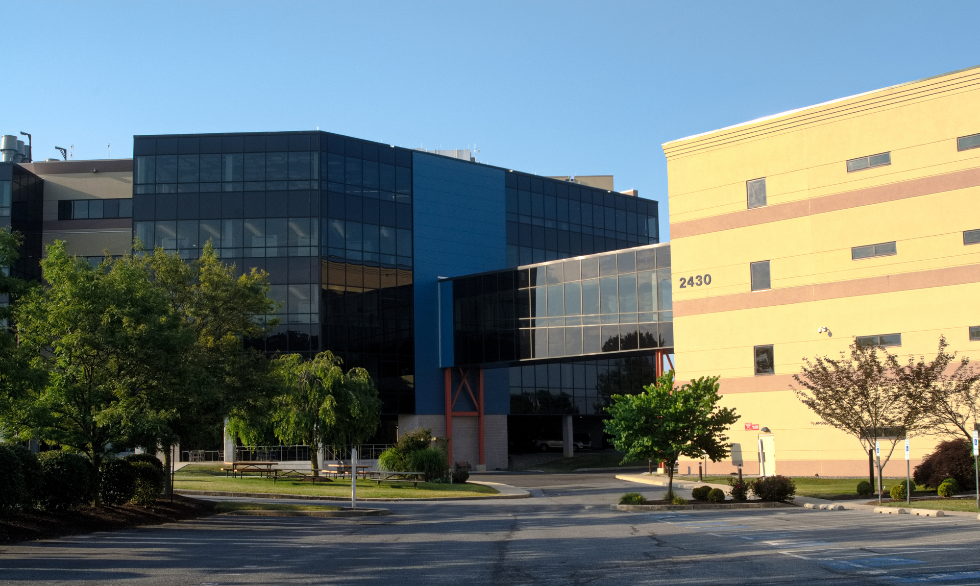 View of hospital buildings, with new building to the left and catwalk connecting it