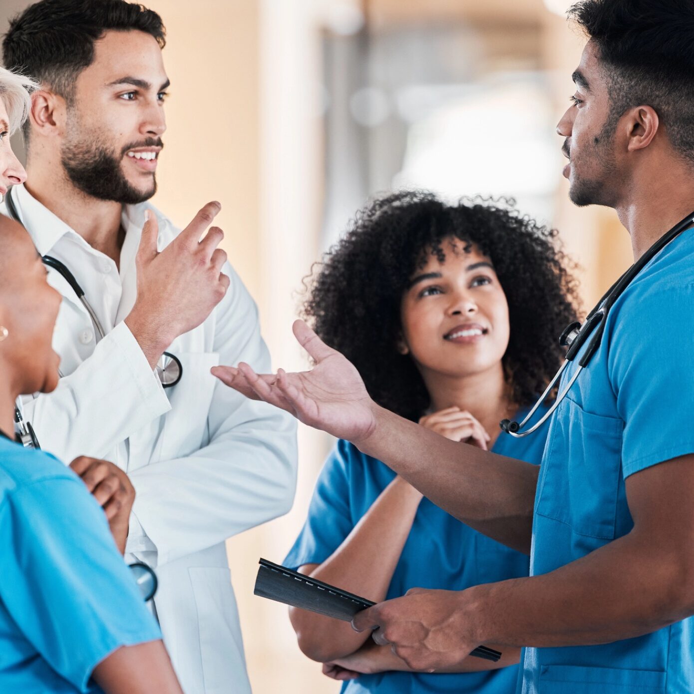 Shot of a group of young doctors having a discussion in a modern office.
